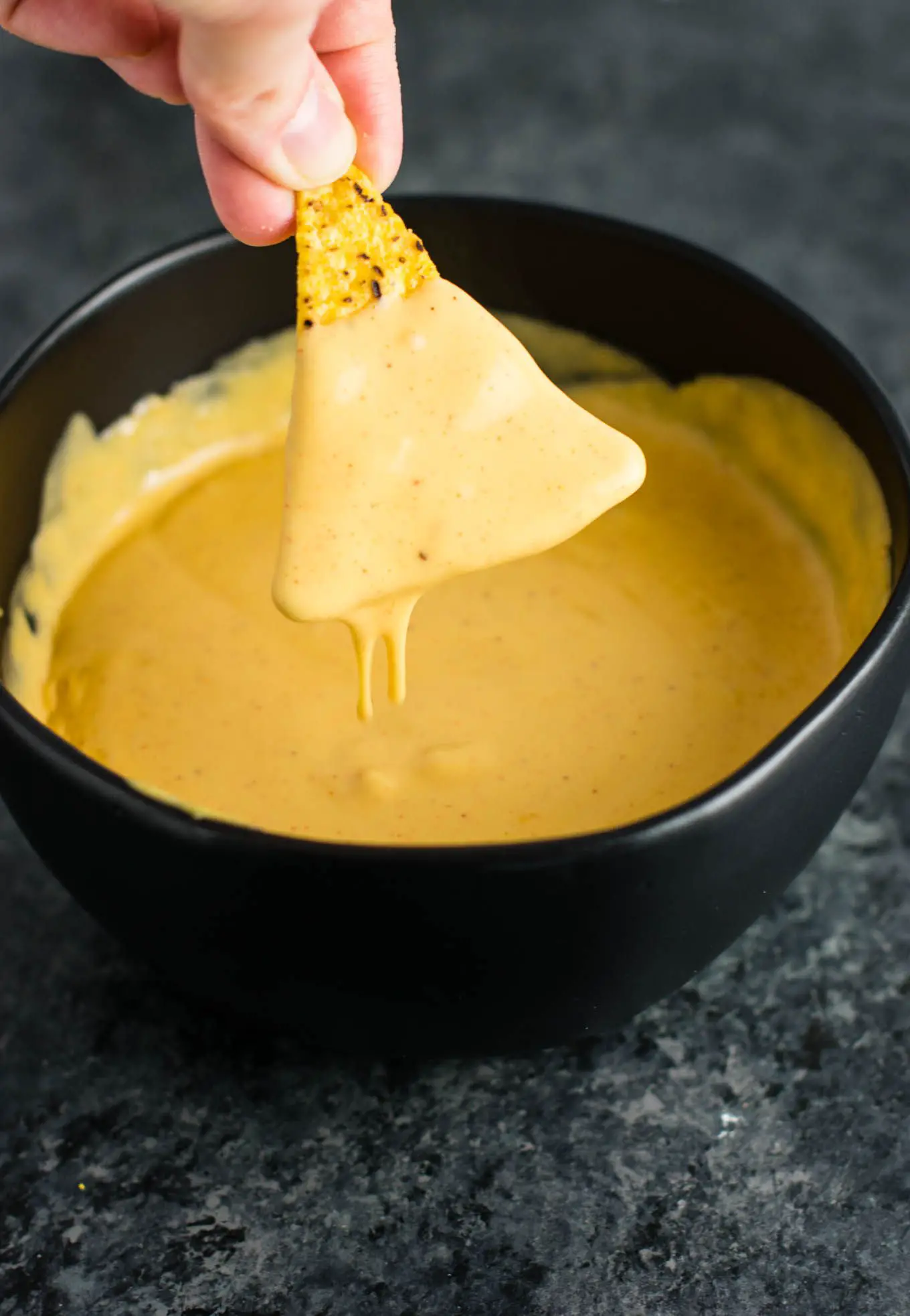 5 minute nacho cheese sauce recipe. Perfect for dipping, or poured over ...
