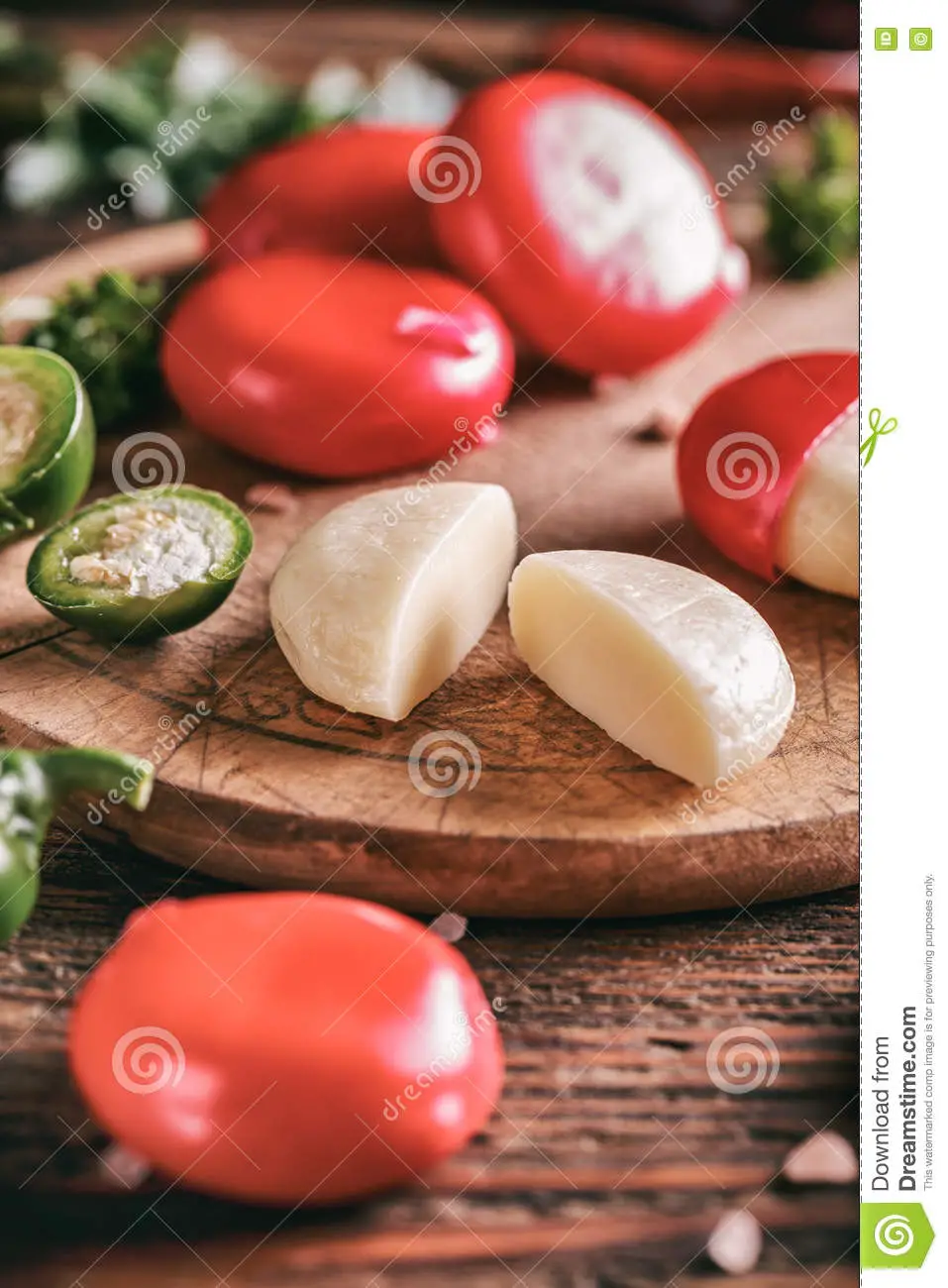Babybel cheese in red wax stock image. Image of wooden